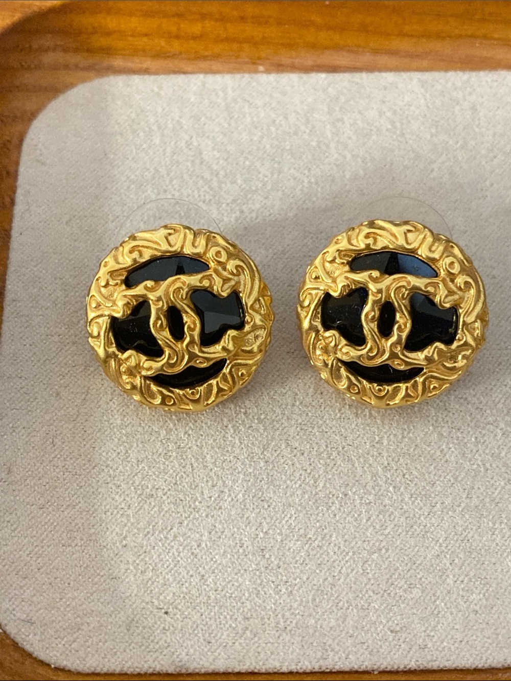CHANEL Gold-Tone Round CC Earrings with Black Enamel